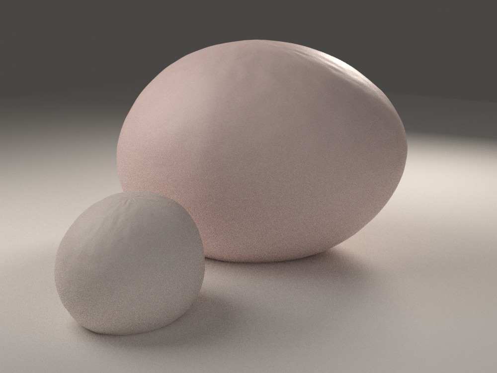 Two soft pebbles, one pink and one cream, resting together in warm light.